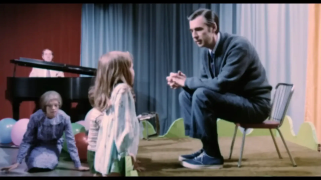 mr rogers talks with a child